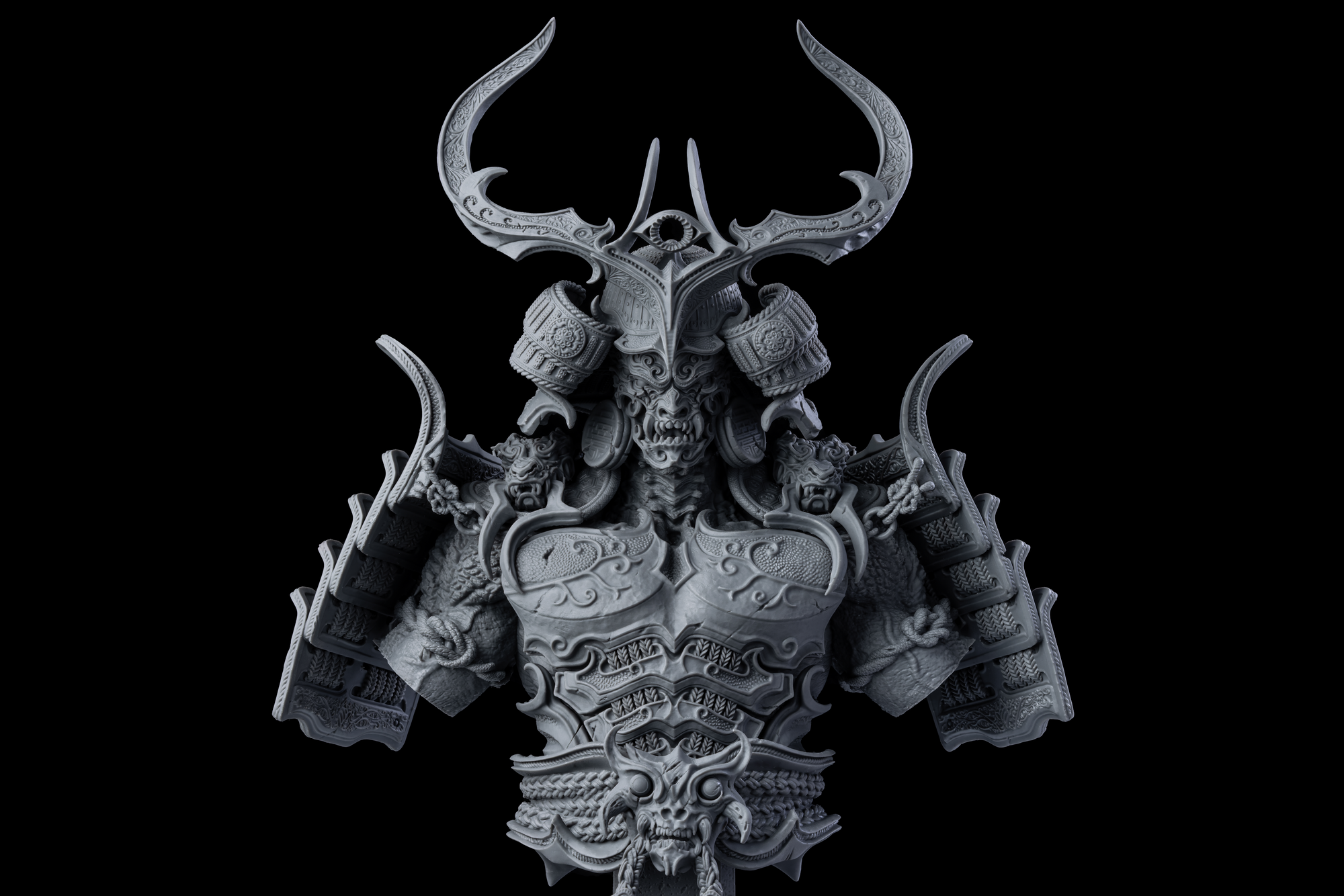 Two hands holding two highly detailed 3D printed monster miniatures, one grey and one painted, over a paint palette